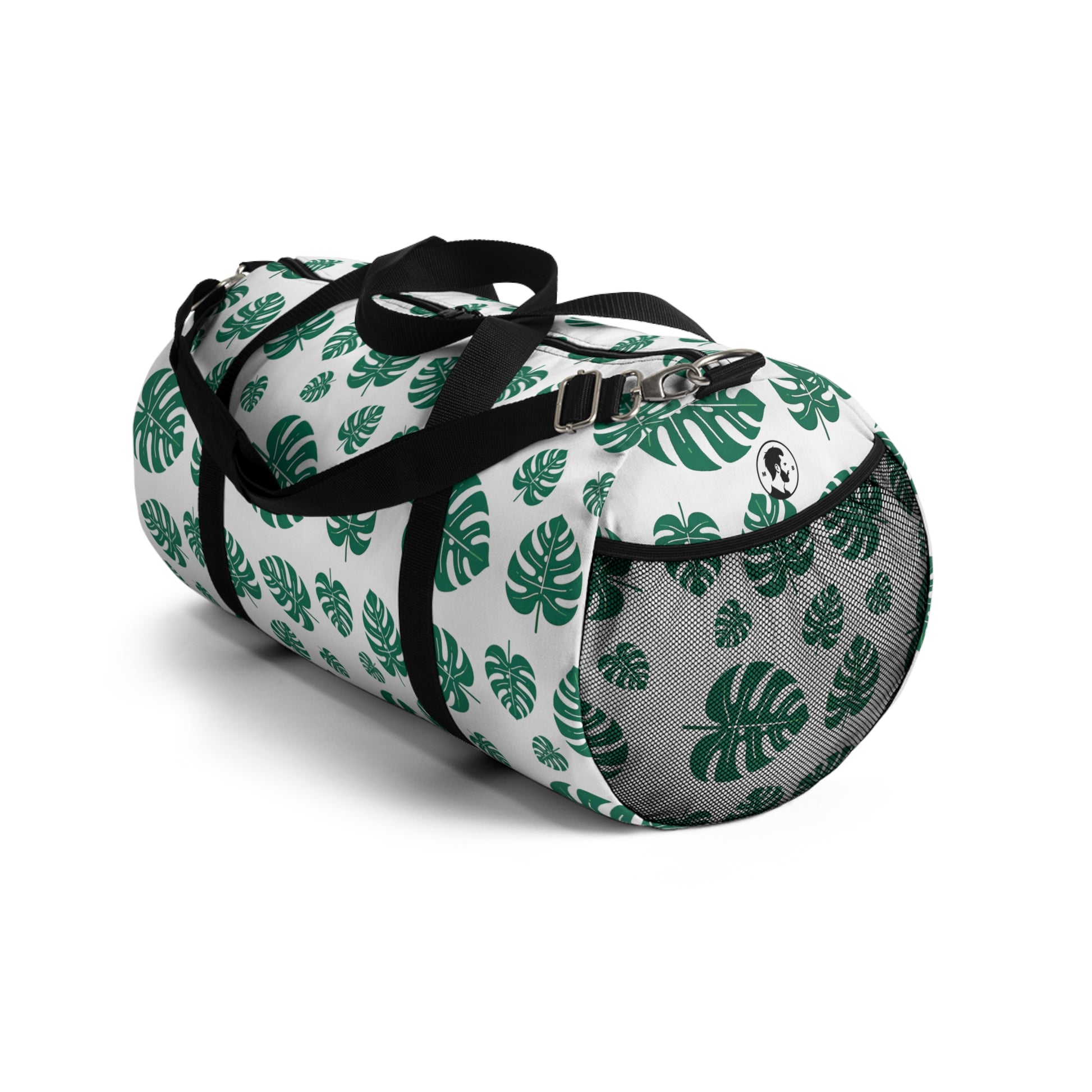 The image shows a cylindrical duffel bag patterned with green tropical leaves and equipped with a black shoulder strap