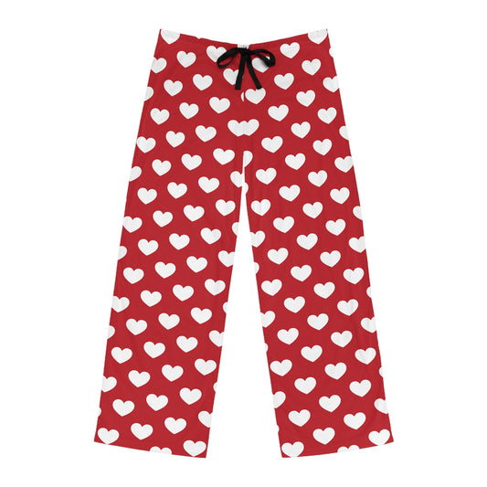 Red pajama bottoms with an all-over print of white hearts, complete with a comfortable black tie at the waist for adjustment