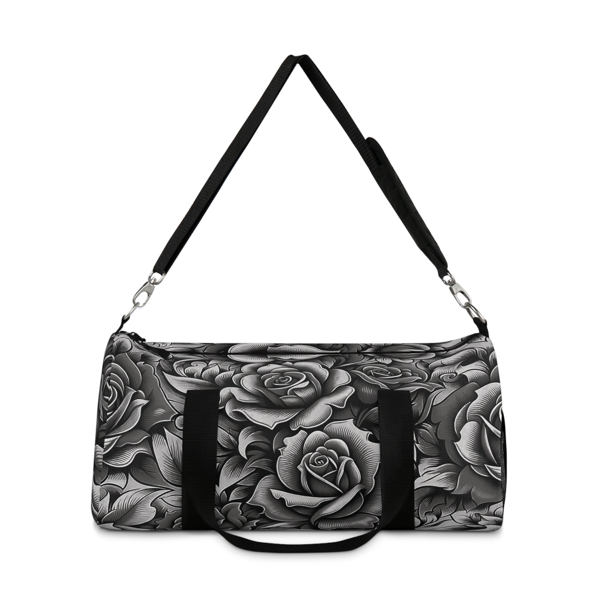 A duffel bag with a monochromatic rose pattern and a black strap.