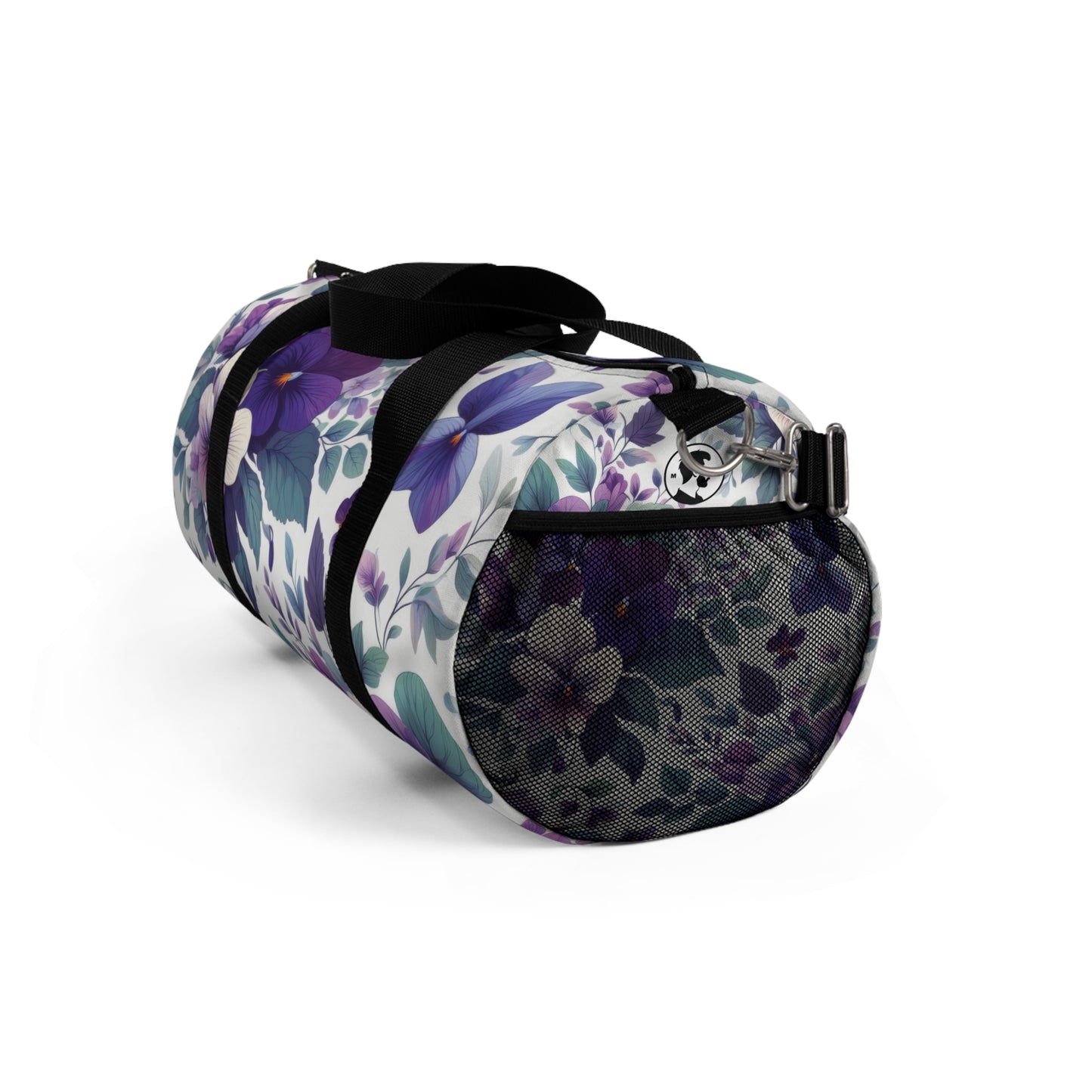 The image shows a cylindrical duffel bag with a floral pattern, featuring a variety of purple flowers and green leaves, complete with black straps for carrying