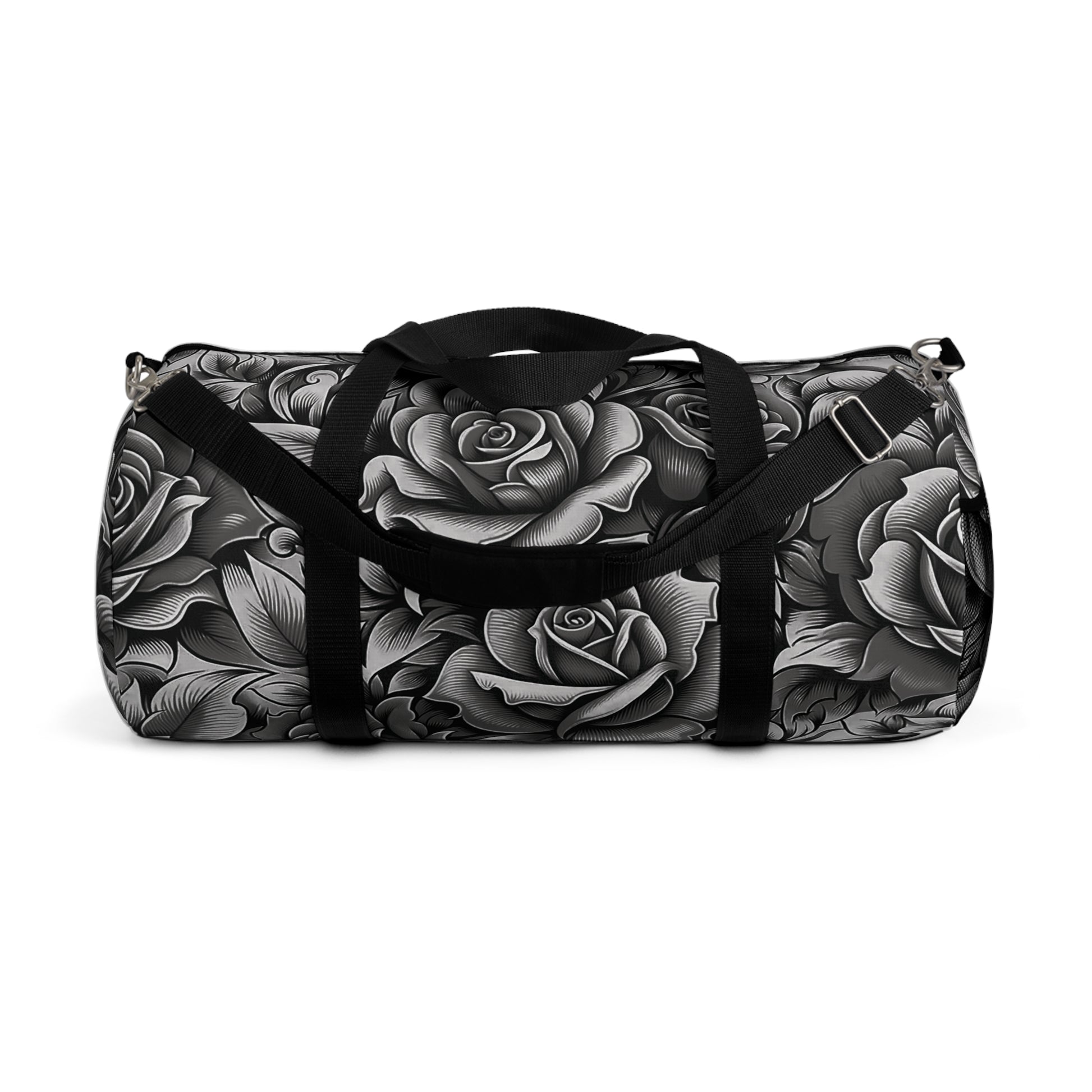 A duffel bag with a monochromatic rose pattern and a black strap.