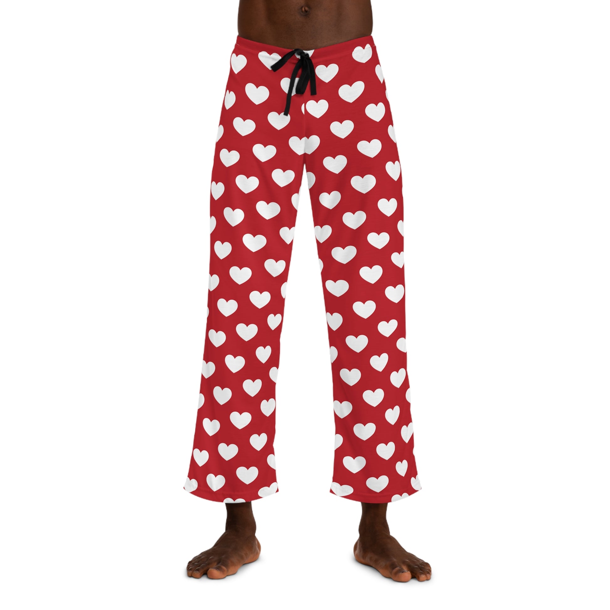Red pajama bottoms with an all-over print of white hearts, complete with a comfortable black tie at the waist for adjustment