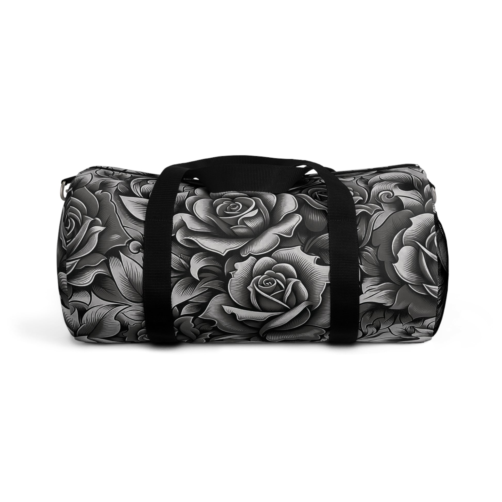 A duffel bag with a monochromatic rose pattern and a black strap.