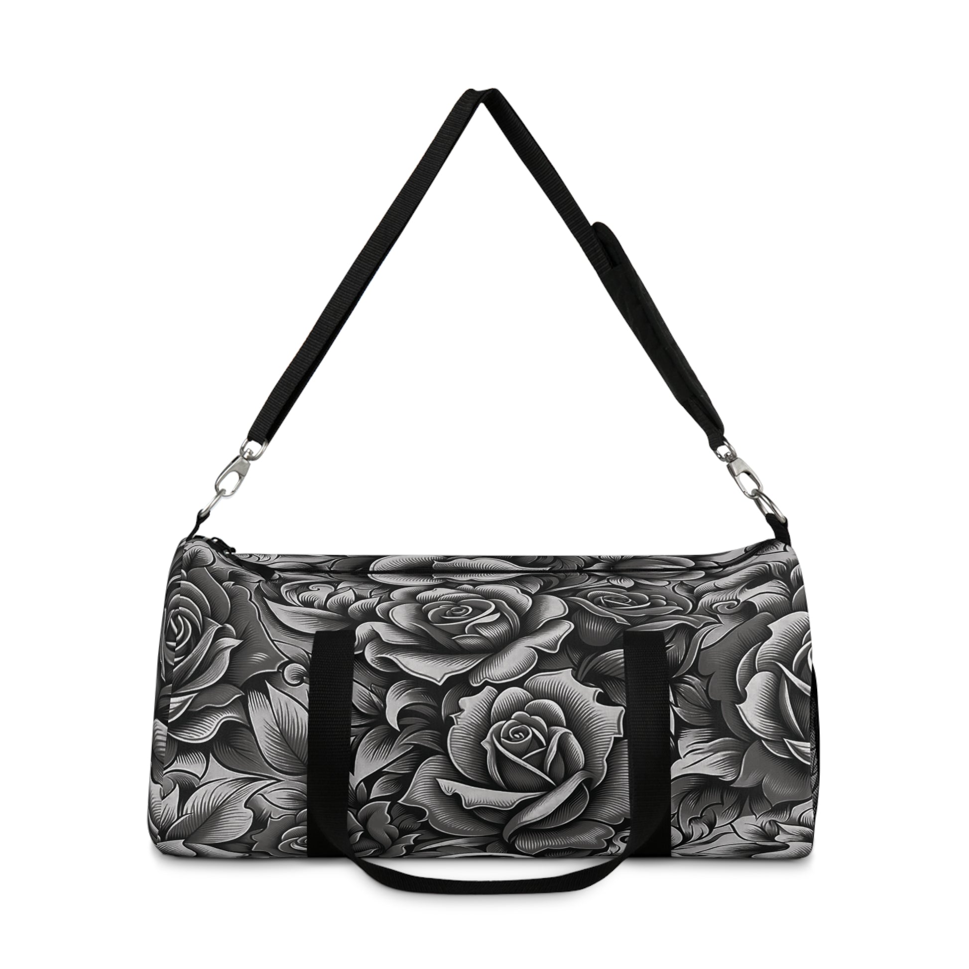 A duffel bag with a monochromatic rose pattern and a black strap.