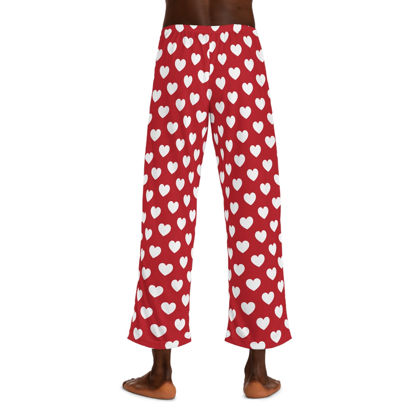 Red pajama bottoms with an all-over print of white hearts, complete with a comfortable black tie at the waist for adjustment