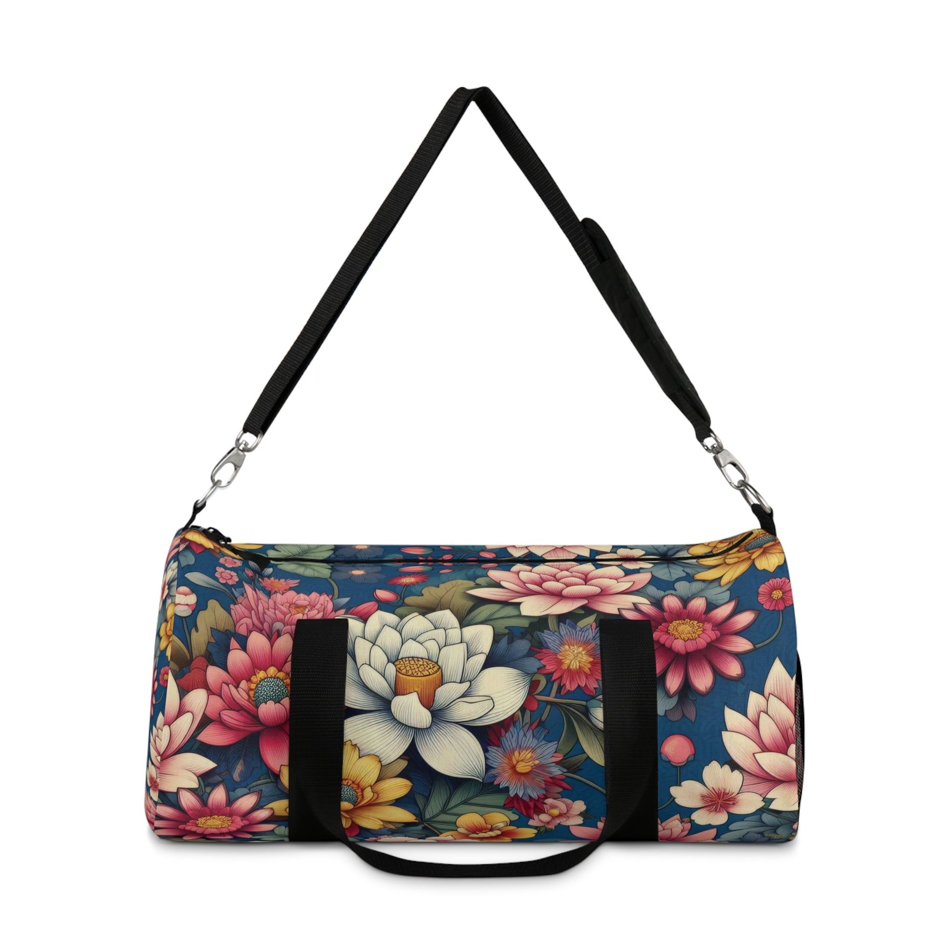 The image depicts a cylindrical duffel bag with a colorful floral pattern and a black shoulder strap.